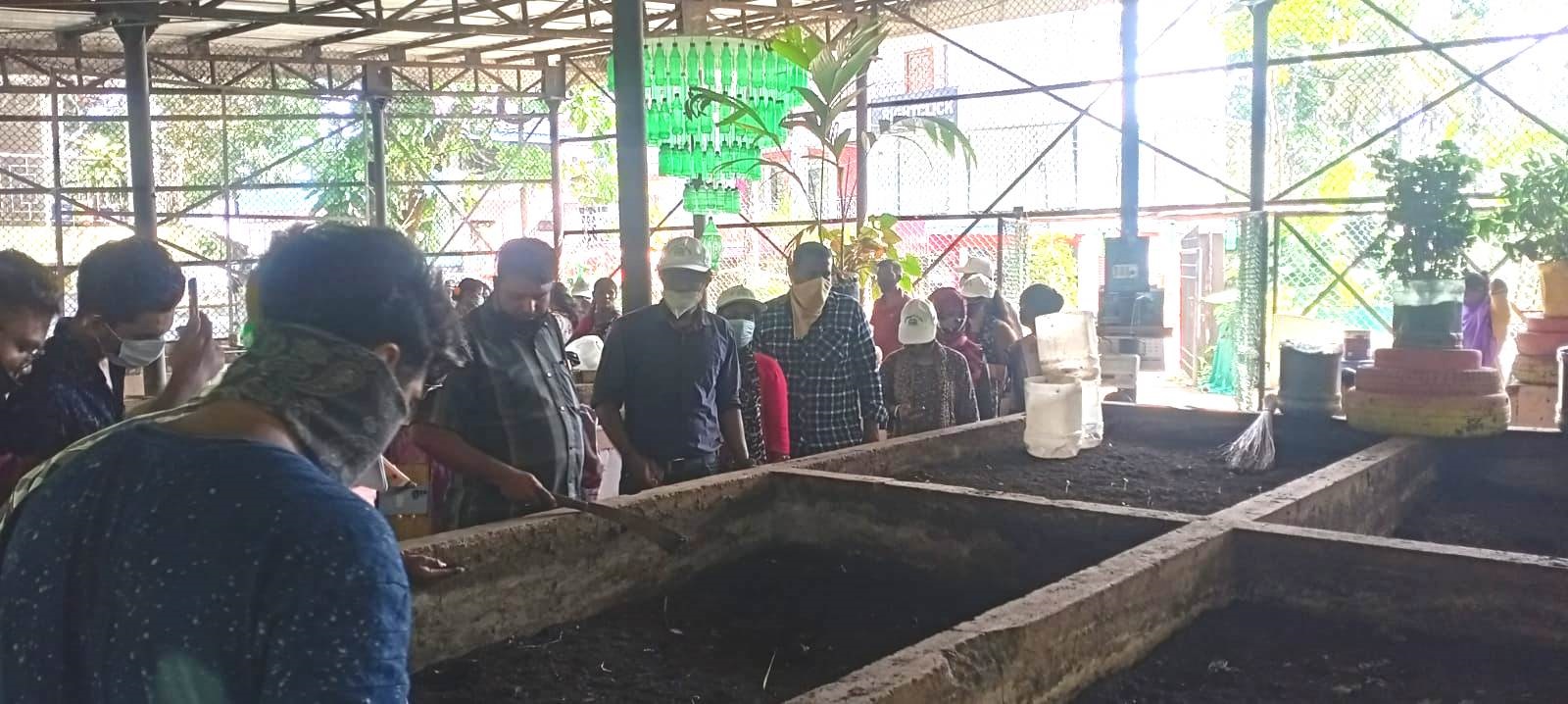 Participants observing the composting pit at Gandhi Park, Port Blair